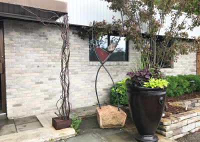 Custom Art Piece and Awning by Metalsmiths Design and Gardenstone Planter