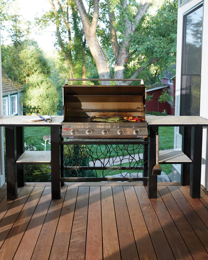 Minnesota-summertime-favorite-natural-gas-grill-in-steel-frame-and-stone-countertop