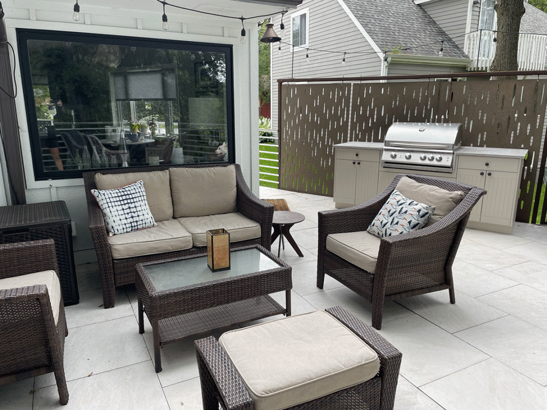 conversation set on new raised porcelain deck and outdoor kitchen in mn